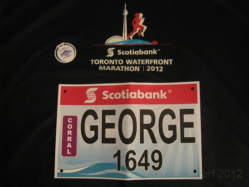 2012 Toronto WM 086.jpg - The personalized bib. Sorta nice, lots of people yelling "Go George". Next year I think I will ask for "Fish"